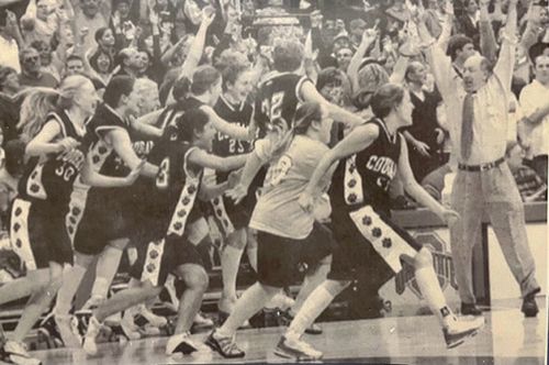 MOUNT NOTRE DAME
														BASKETBALL 2003-04 bench players running onto the court